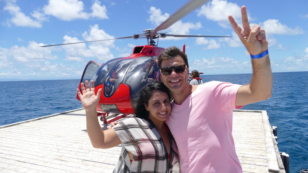 Couple beside Helicopter